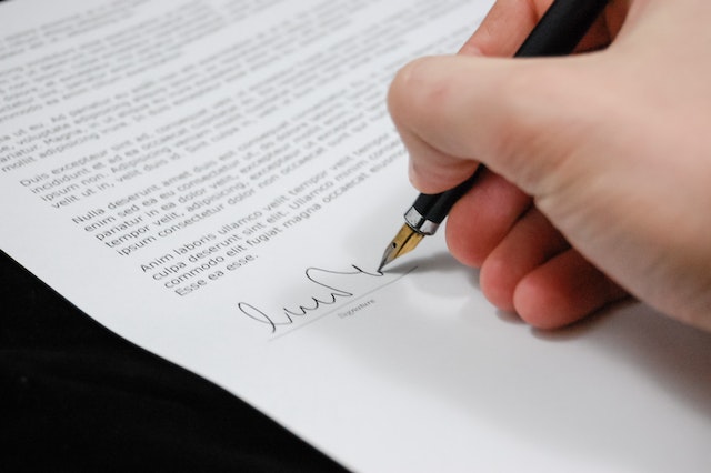A person signing legal documents