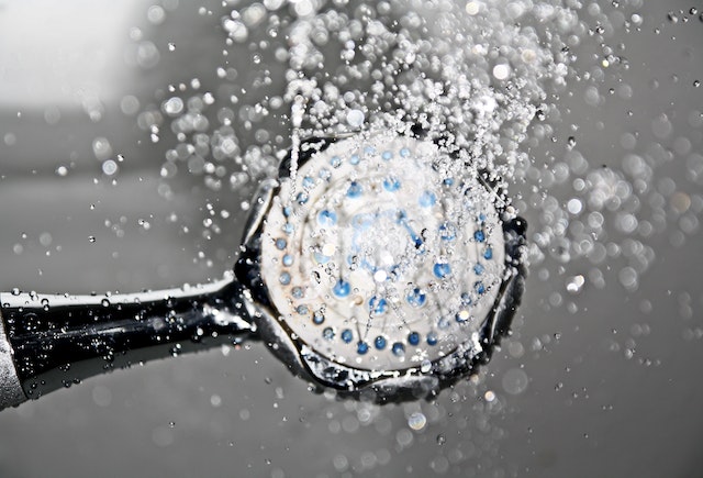 A shower head with water running